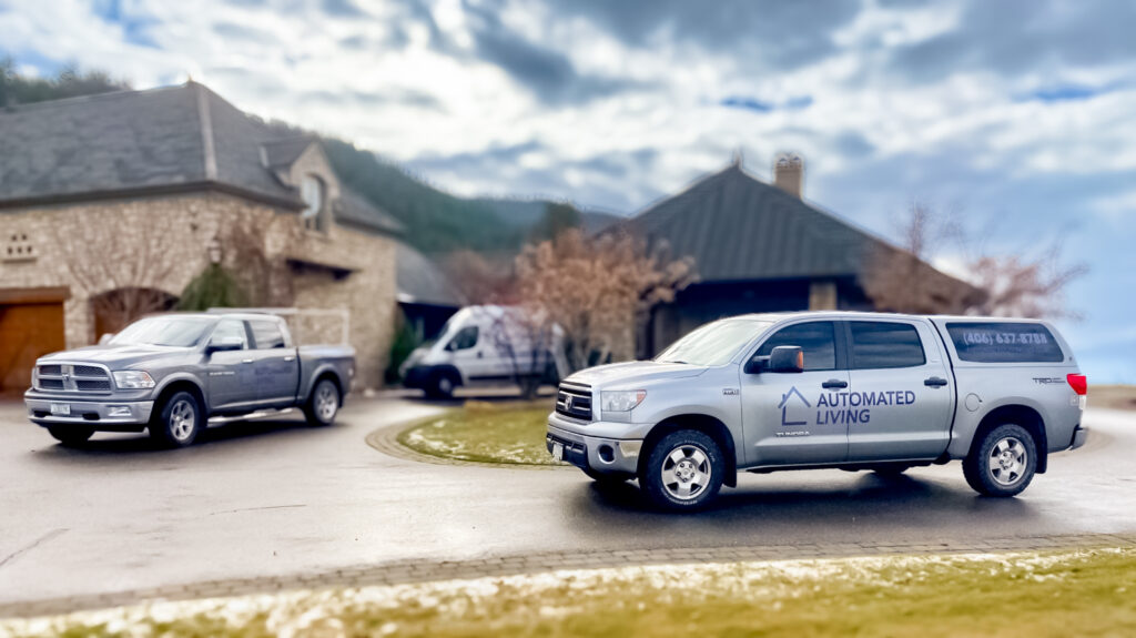 Automated Living Work Vehicles in front of a home in Missoula
